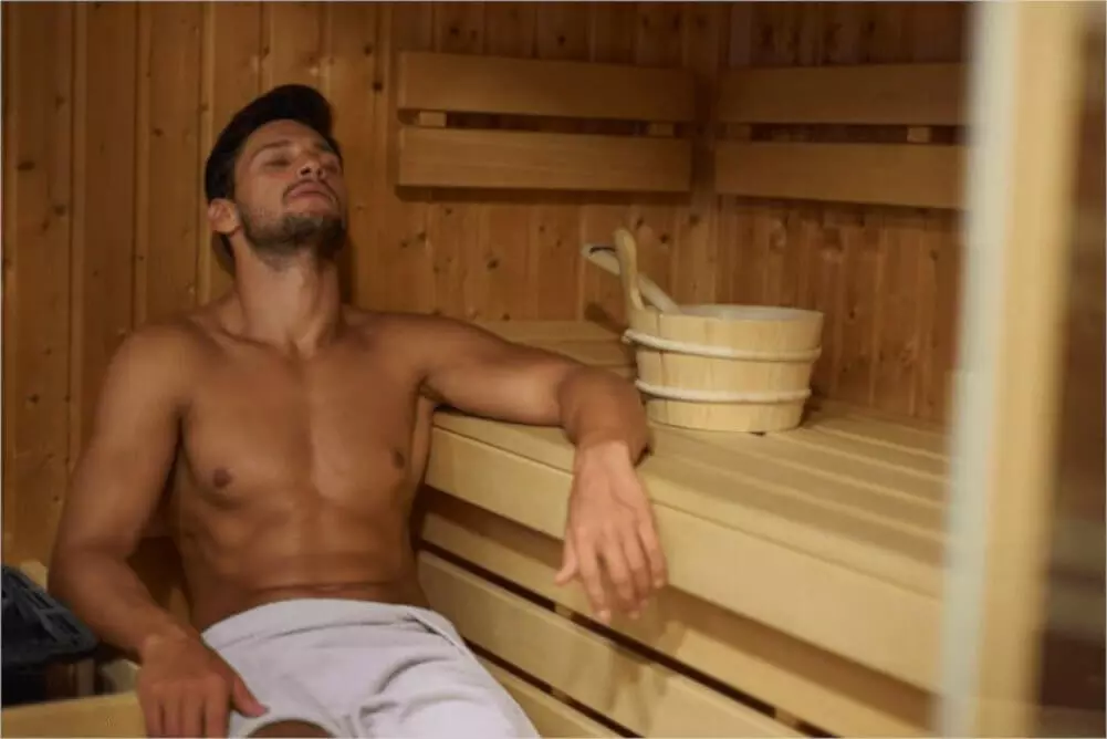man in far infrared sauna room