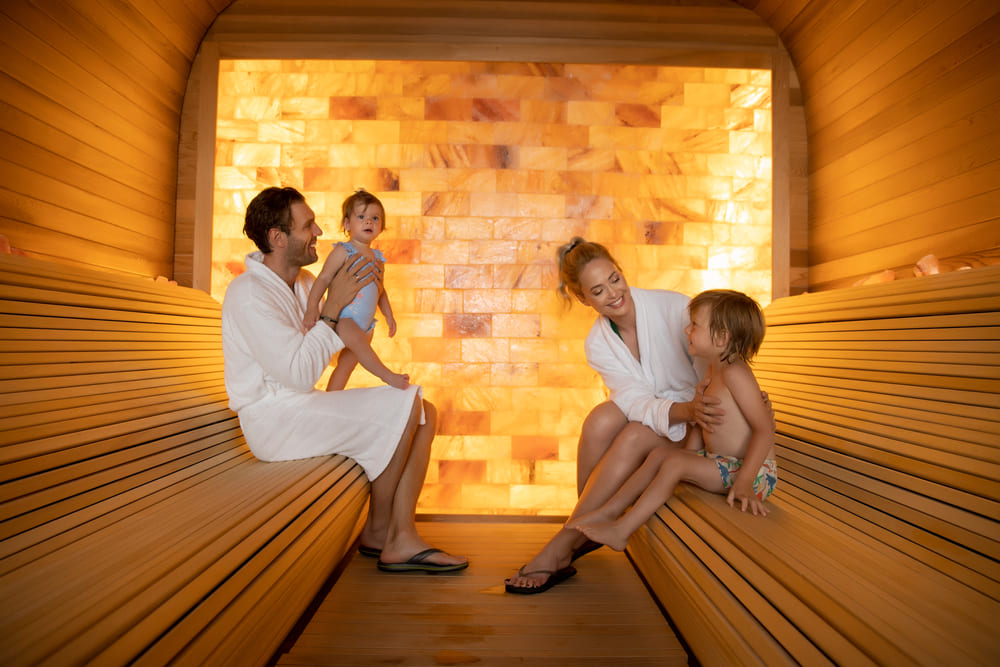 Happy family relaxing in the salt room

